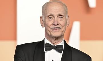 John Waters says he'd use AI to cure cancer but never to write