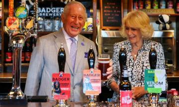 King Charles jokes about drowning sorrows after football loss