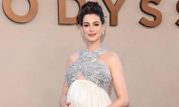 Anne Hathaway fights back tears after Whoopi Goldberg's emotional tribute