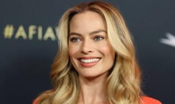 Margot Robbie turns heads in chic yellow ensemble during Paris stroll