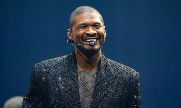 Usher halts viral fan moment after awkward onstage reaction