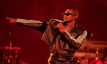 Usher stops onstage dance after noticing fan's reaction